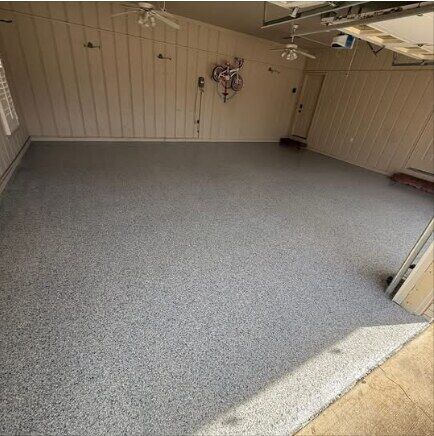 Finished dark flake epoxy garage floor