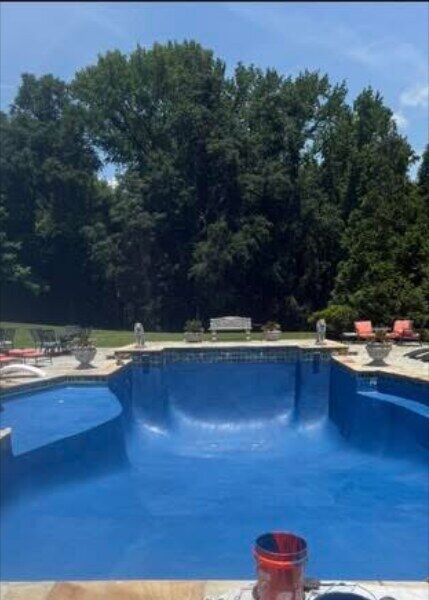 Gunite pool recoated in royal blue epoxy